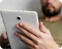 close-up-adult-holding-tablet 1.png